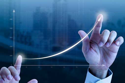 A person holding their hand up to the sky