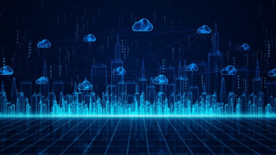 A city skyline with blue lights and clouds.